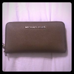 Lightly used Micheal Kors Tan Wallet!